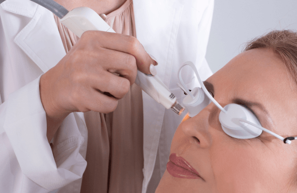 A woman undergoing a dry eye treatment