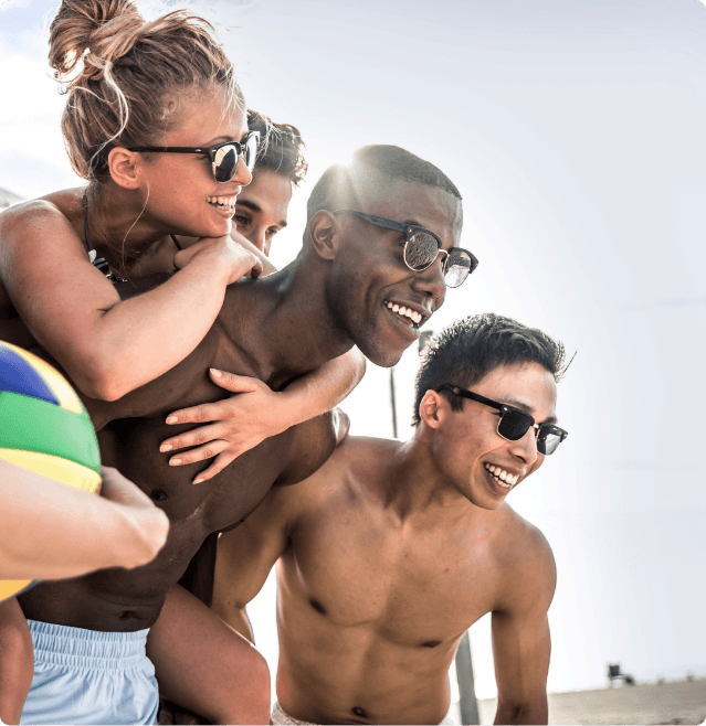 Group of Friends hairless and happy on the beach after getting LightSheer® QUATTRO™ laser