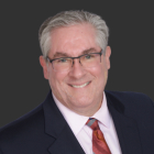 Dr. Emilio M. Justo MD — ophthalmologist and CO₂ laser blepharoplasty specialist, founder of Arizona Eye Institute and Cosmetic Laser Center